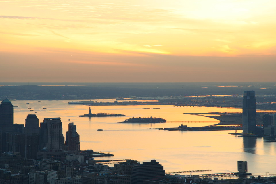 Sunset Over Statue of Liberty in New York, New York