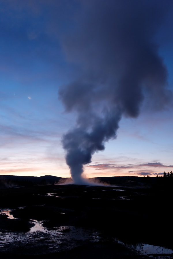 Moon and Geyser in Yellowstone National Park, Wyoming